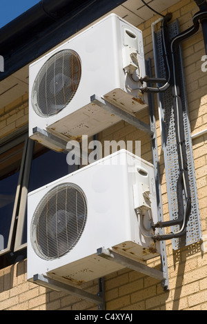 Air conditioning ventilation and cooling fans using heat exchange on the exterior of the leisure centre in Cowbridge, Glamorgan Stock Photo