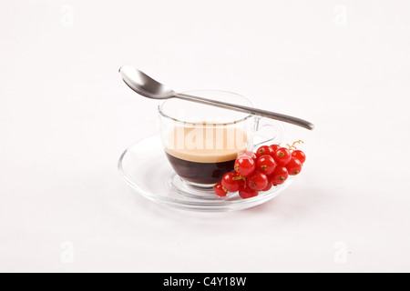 photo of espresso with currant in glass cup on white isolated background Stock Photo