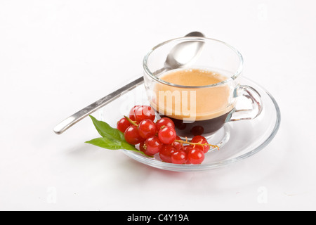 photo of espresso with currant in glass cup on white isolated background Stock Photo