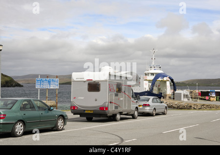 Gutcher, Yell, Shetland Islands, Scotland, UK. Car Ferry terminal with car and motorhome queuing for Unst across Bluemull Sound