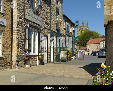 Local independent shops store Market Place from Borogate All Saints Church in background Helmsley North Yorkshire England UK United Kingdom Britain Stock Photo