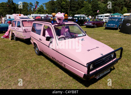 Reliant robin restored in pink at a car show 2011 nottinghamshire Stock Photo