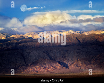 Panamint Mountains with moon and snow. Death Valley National Park, California Stock Photo