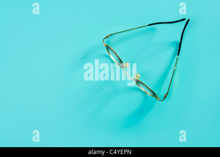 doctor glasses with soft shadow over green desk background Stock Photo