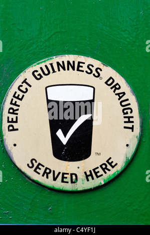 Old Guinness Sign Outside A Pub In Edinburgh Scotland Stock Photo