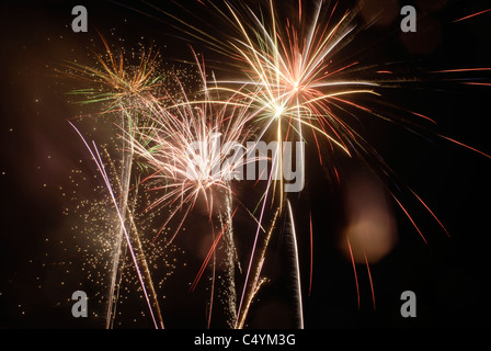 Fireworks display against black background during a rainstorm in upstate New York. © Craig M. Eisenberg Stock Photo