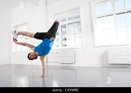Young Man Doing Handstand Stock Photo