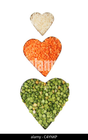 Rice, lentils and dried split peas in heart shaped frames Stock Photo