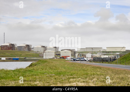 Shetland Islands, Scotland, UK, Britain. Propane gas and crude oil storage tanks by the entrance to Sullom Voe Oil Terminal Stock Photo