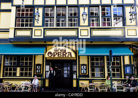 Customers sit outside the Drug Opera tavern and restaurant in central Brussels. Stock Photo