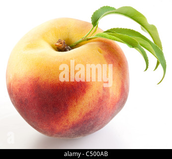Ripe peach with leaves isolated on a white background. Stock Photo
