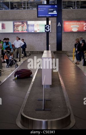 Luggage circles on the baggage carousel at the Winnipeg James Armstrong Richardson International Airport Sunday May 22, 2011. Stock Photo