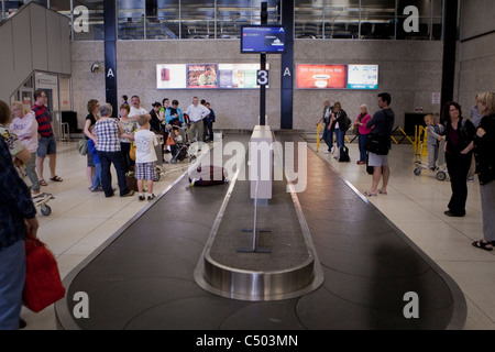 Luggage circles on the baggage carousel at the Winnipeg James Armstrong Richardson International Airport Sunday May 22, 2011. Stock Photo