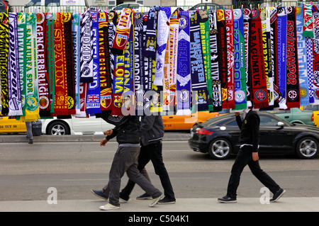 Colorful scarfs as merchandise of Turkish and European football clubs hanging for sale by the wayside in Istanbul,Turkey Stock Photo