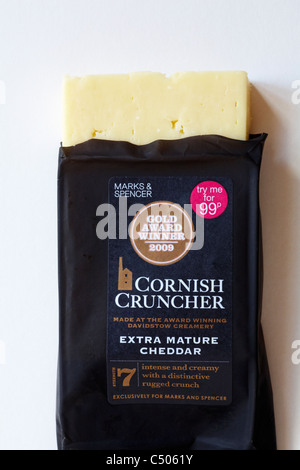 Small packet of Marks & Spencer Cornish Cruncher extra mature cheddar cheese undone to show contents, set on white background Stock Photo