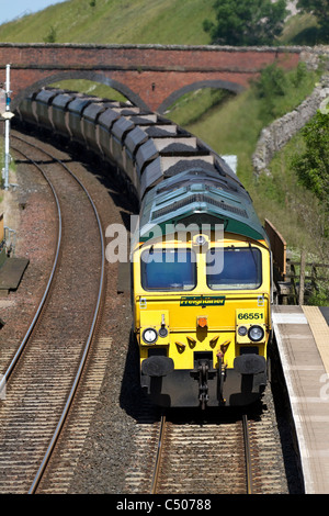 Freight Liner Wagons  Transporting Coal by British Railways  Coal Hoppers & Goods train at Tebay Station, Settle Carlisle, Cumbria, UK Stock Photo