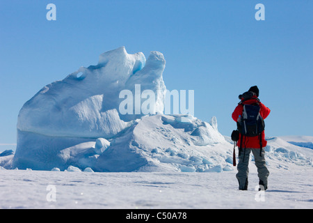 Tourist photographing iceberg, Snow Hill Island, Antarctica Stock Photo