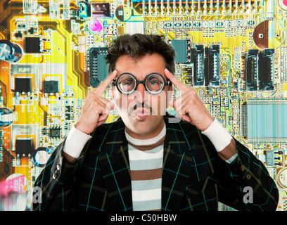 Genius nerd electronic engineer tech man thinking gesture electronics motherboard chip background Stock Photo