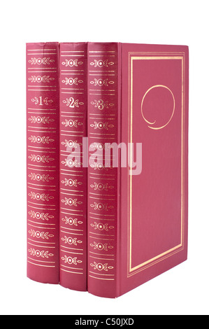 Vertical stack of three red books isolated over white background. Trilogy Stock Photo