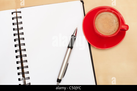 Espresso Coffee, Blank Paper Notebook and Ballpoint on Wooden Table Stock Photo