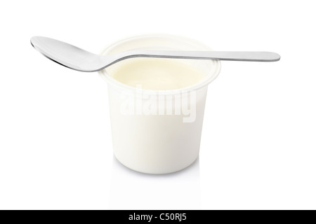 Yogurt pot and spoon Stock Photo