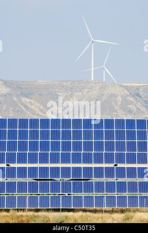 photovoltaic panels and windmills in the hill Stock Photo