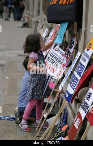 Little girl with placards at Pensions Strike demo 30 June 2011 London England UK Stock Photo