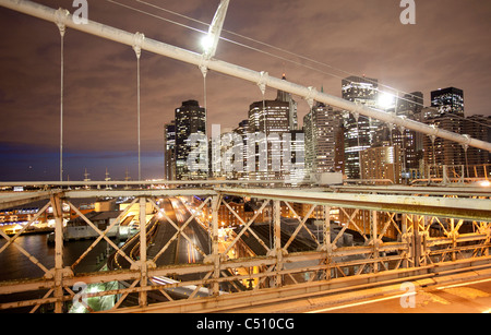 shot of lower manhattan from brooklyn bridge at night Stock Photo