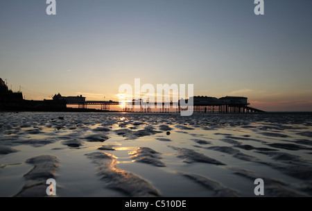 Cromer Pier just before the sun sets during an evening in June Stock Photo