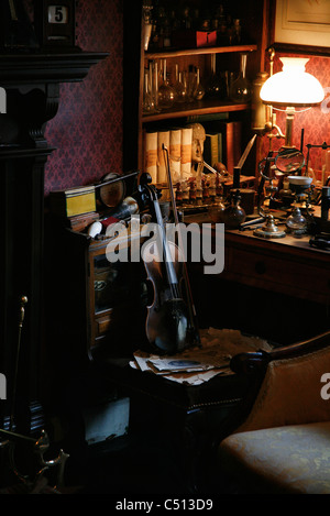 Violin by desk Stock Photo