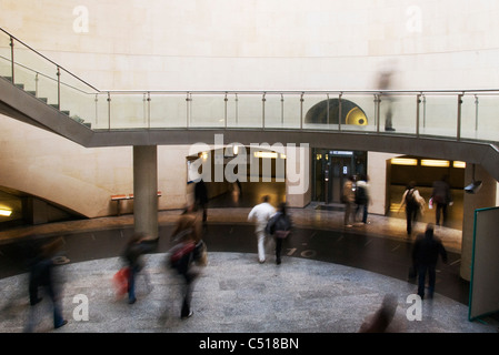 Commuters walking into metro station Stock Photo