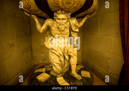 A sculpture of Atlas holding up the world is displayed in the Museum of the Cathedral in Santiago de Compostela, Spain Stock Photo