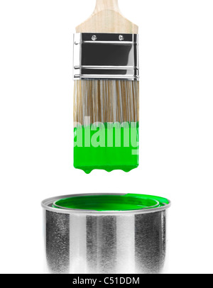 Painting brush dipped in can of green paint isolated on white background Stock Photo