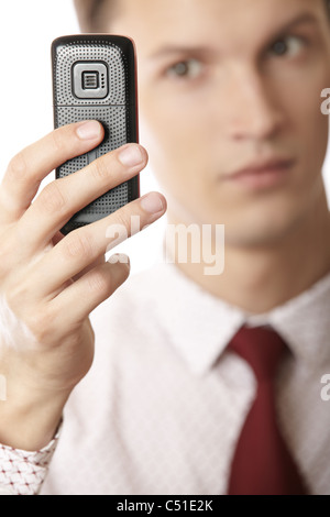 Businessman using cellular phone as GPS and Internet device Stock Photo
