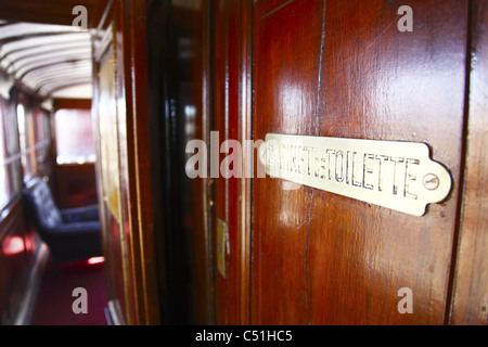 Africa, Tunisia, Metlaoui, Red Lizard ( Lezard Rouge ) Train, Interior Wooden Bathroom Door Stock Photo