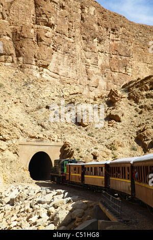Africa, Tunisia, Metlaoui, Selja Gorge, Red Lizard ( Lezard Rouge ) Train entering Tunnel Stock Photo