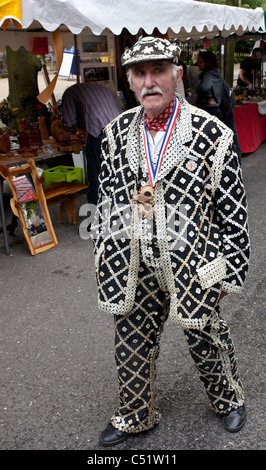 Full length portrait of a senior male dressed as pearly king, Highgate, London, England, UK Stock Photo