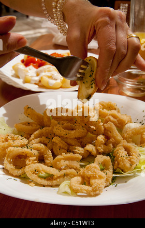 Granada Spain fried calamari squid lemon squeeze tapas Stock Photo