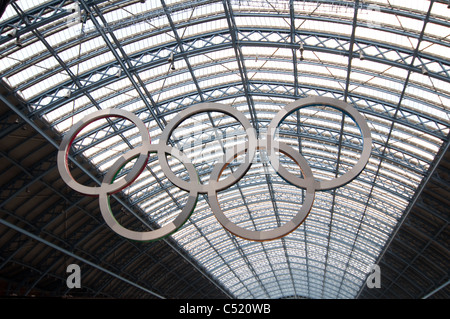 Olympic rings hang from the roof of St. Pancras International Station in London for the 2012 games. Stock Photo