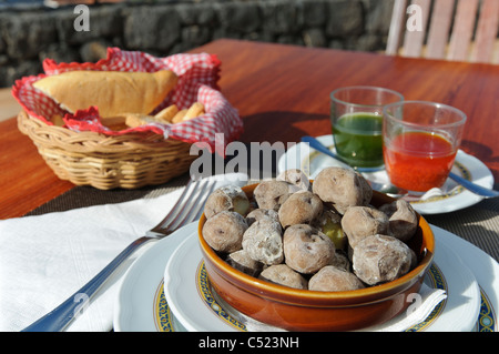 Traditional Canarian cuisine, Canarian wrinkly potatoes, Papas Arrugadas with Rojo Mojo and Mojo Verde sauces, Tenerife Stock Photo