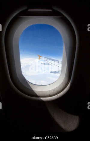 Airplane window from inside Stock Photo