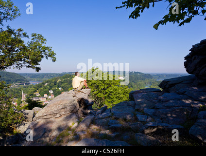 Senior male hiker overlooking the shenandoah and potomac rivers by the town of Harpers Ferry Stock Photo