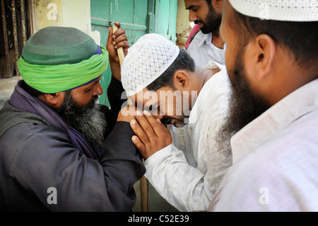 Sufi Fakirs (Muslim holy man) at the annual Urs (death anniversary) of the Sufi saint Moinuddin Chisti Stock Photo