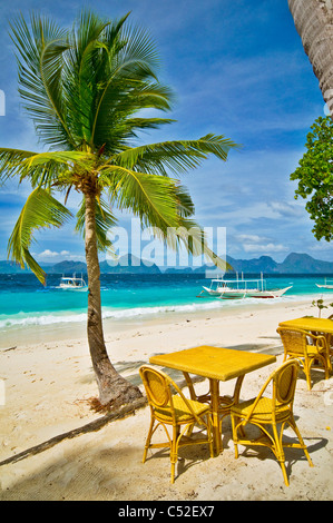 Sunny beach with cafe table Stock Photo