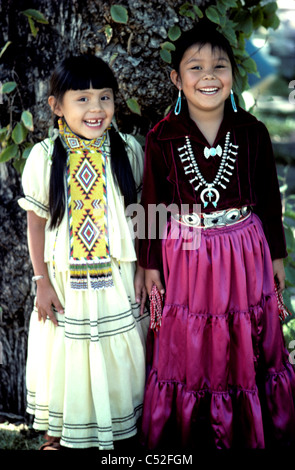 Two pretty Navajo indian girls pose in traditional native American dress ethinc Stock Photo