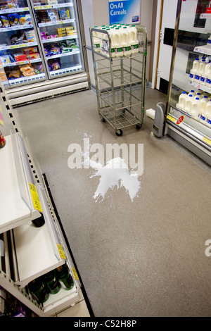Spilt milk accident at a supermarket Stock Photo