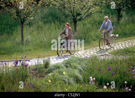 Couple rides bicycles near Baggersee, Germany. Stock Photo
