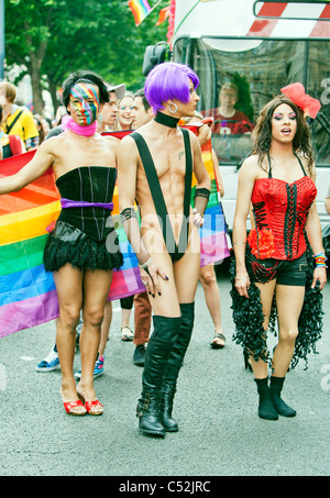 Coloufrul scantily-clad characters attending London's Gay Pride 41 years. Anniversary Parade - London 2nd.July 2011 England, UK Stock Photo