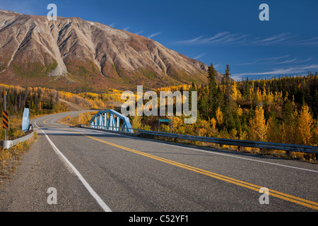 Scenic Autumn view along the Alaska Highway at the Takhanne River Bridge, Yukon Territory, Canada Stock Photo