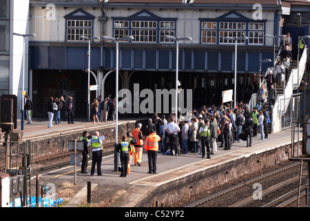 Undertakers recover the body of a suicide victim hit by a train at Clapham Junction Stock Photo